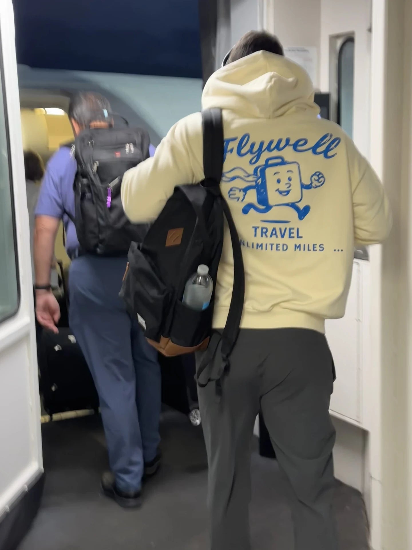 Mr Suitcase hoodie while boarding a flight
